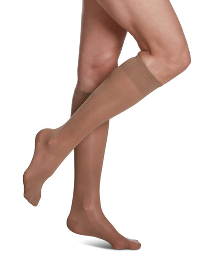 Taupe knee-high socks with navy tops on a white background