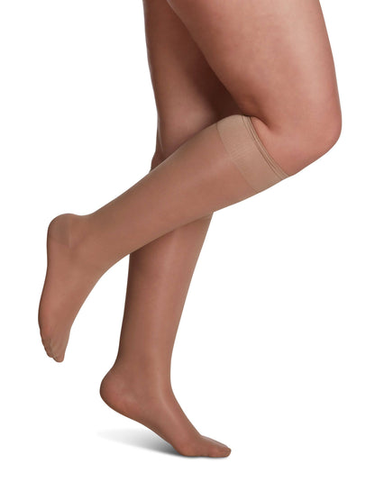 Golden knee-high socks with navy tops on a white background