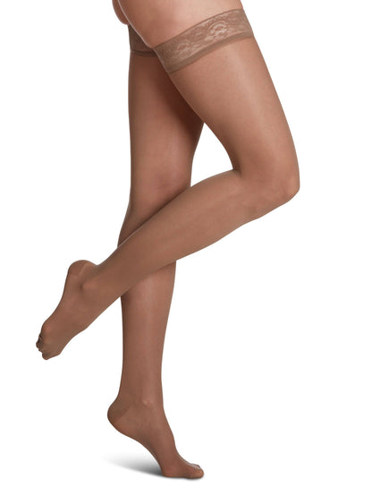 Taupe knee-high socks with navy tops on a white background