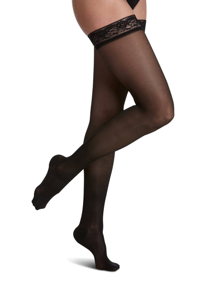 Black sheer stockings with lace top on a white background
