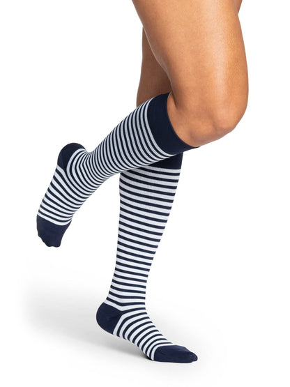 Navy and white striped knee-high socks on a white background