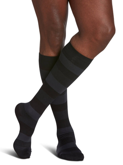 Black and gray striped knee-high socks on a white background