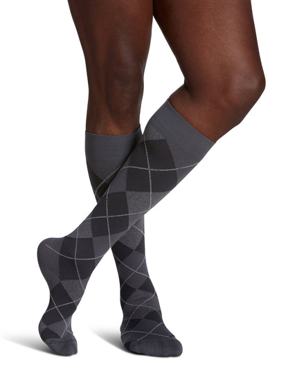 Black and gray striped knee-high socks on a white background
