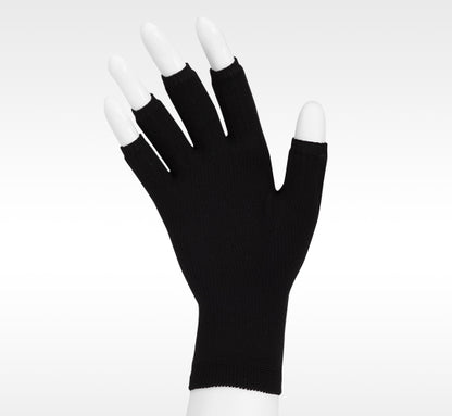 Black fingerless glove with white fingertips on a white background. Explore the Juzo Compressionsale collection of compression accessories designed for comfort, support, and everyday wear.