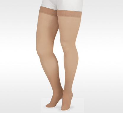 Beige tights worn by a person on a white background in Juzo from compressionsale 