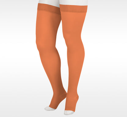 Orange tights worn by a person on a white background in Juzo from compressionsale 