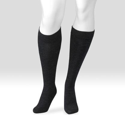 Black knee-high socks on a white mannequin against a light gray background. Explore the Juzo Compressionsale collection of compression hosiery designed for comfort, support, and everyday wear.