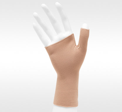 Beige fingerless glove on a white mannequin hand against a white background. Discover the Juzo Compressionsale collection of compression accessories designed for comfort, support, and everyday wear.