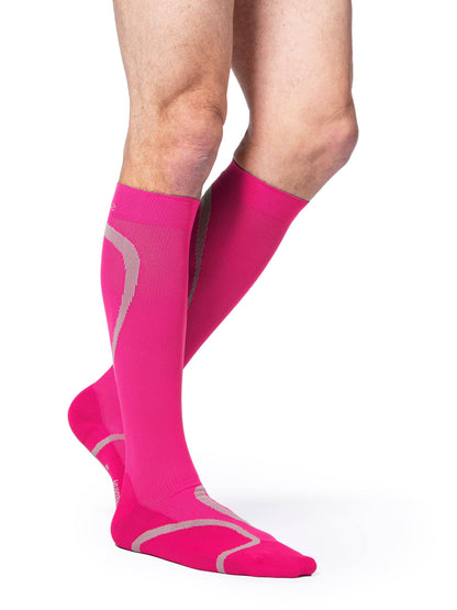 Pink compression socks with gray accents on a white background