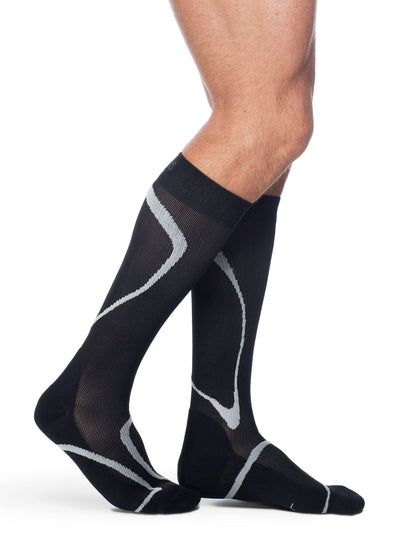 Black compression socks with gray accents on a white background