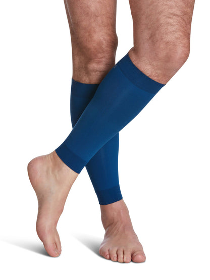 Blue compression sleeves on a person's legs against a white background