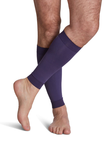 Purple compression sleeves on a person's legs against a white background
