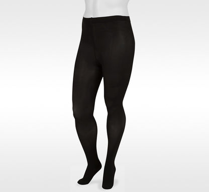 Black tights worn by a person on a white background. Explore the Juzo Compressionsale collection of compression hosiery designed for comfort, support, and everyday wear.