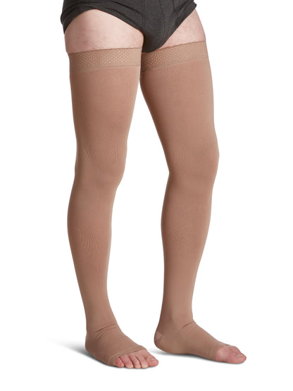 Begie knee-high socks worn by a person on a white background