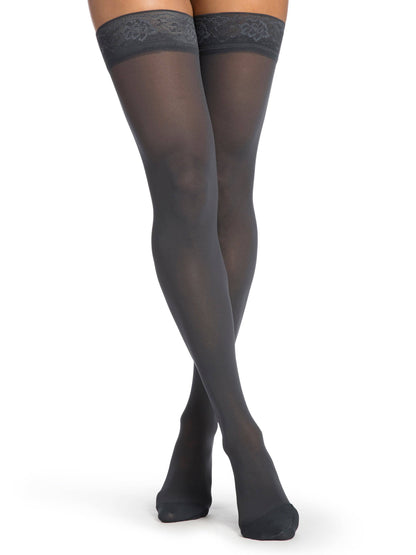 Blue sheer stockings worn by a person on a white background