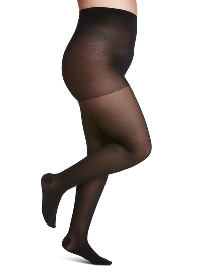 Black sheer tights worn by a model on a white background