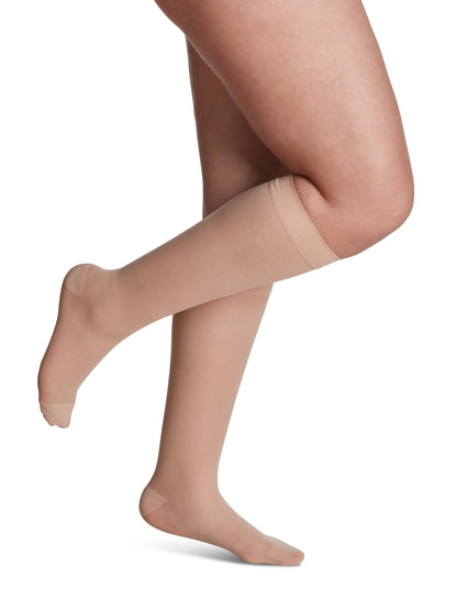 Warm Sand knee-high socks worn by a person on a white background