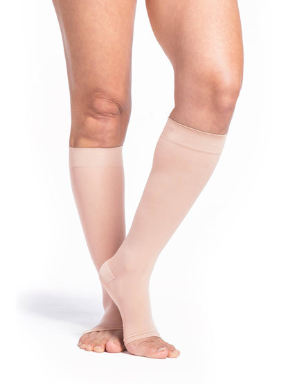 Toasted Almond knee-high socks with navy tops on a white background