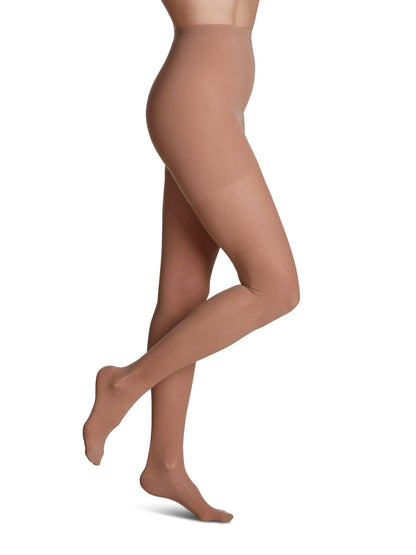 Brown tights worn by a person on a white background