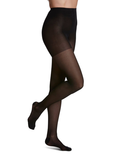 Black tights worn by a person on a white background