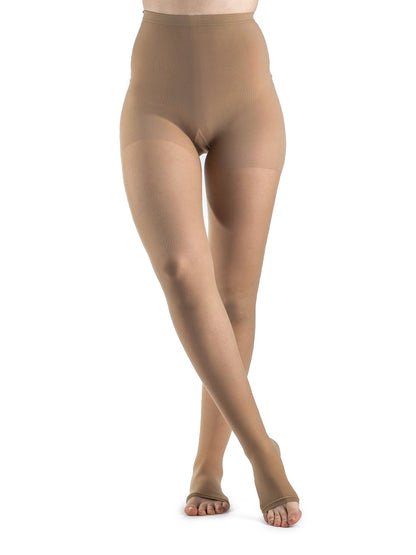 Golden sheer stockings worn by a model on a white background