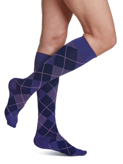 Blue striped socks worn by a person on a white background