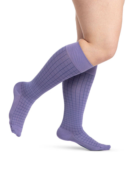 Light Blue striped socks worn by a person on a white background