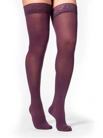 Red tights worn by a person on a white background