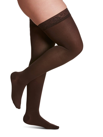 Brown tights worn by a person on a white background