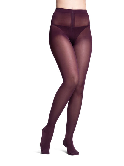 Brown tights worn by a person on a white background