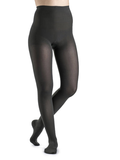 Blue tights worn by a person on a white background