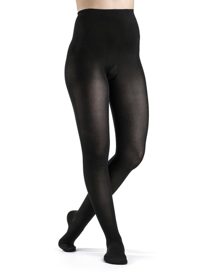 Black tights worn by a person on a white background