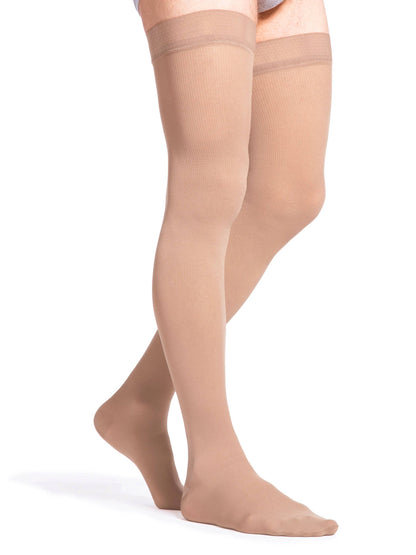 Beige knee-high socks on a white background