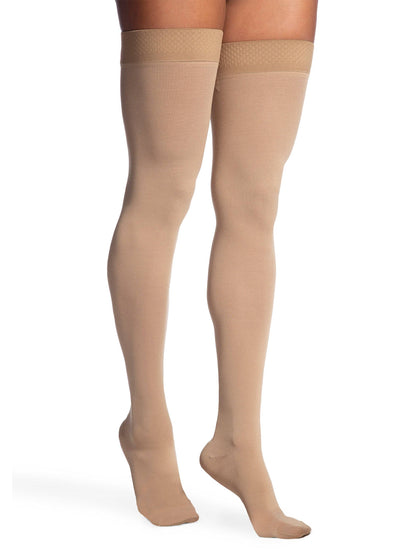 Light Beige sheer stockings with lace top on a white background
