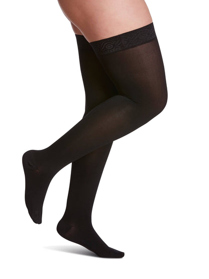 Black sheer stockings with lace top on  white background