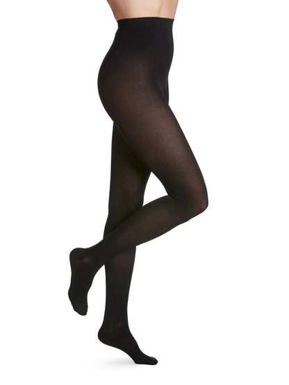 Black tights worn by a person on a white background