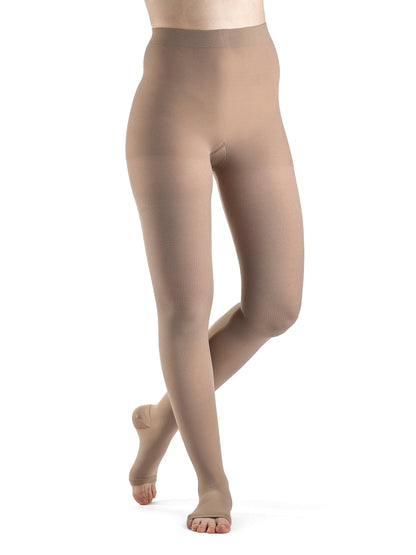 Beige tights worn by a model on a white background