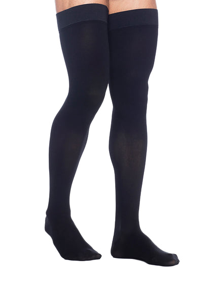 Black tights worn by a person on a white background