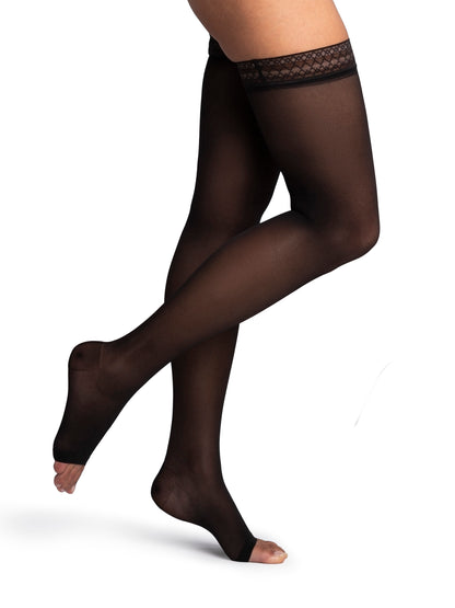 Black sheer stockings worn by a model on a white background