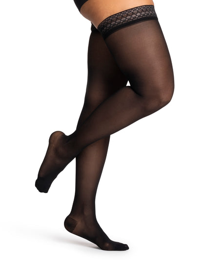 Black sheer stockings with lace top on a white background