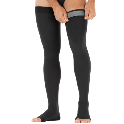 Person wearing black compression stockings from Compressionsale on a white background