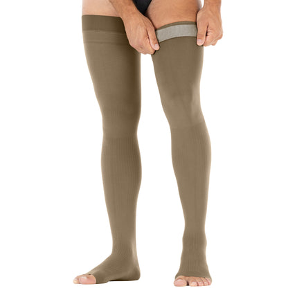 Person wearing olive green knee-high socks from Compressionsale on a white background