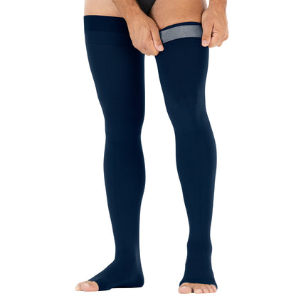 Navy blue compression stockings worn by a person from Compressionsale on a white background.