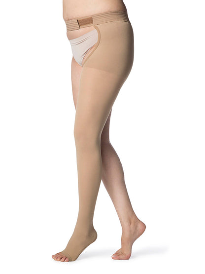 Beige compression stockings being worn on a white background