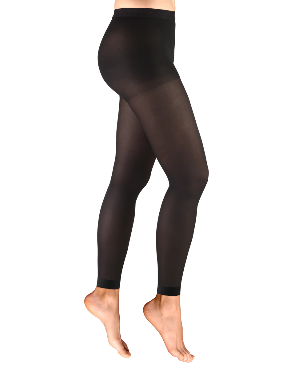 Black leggings worn by a person on a white background in Truform from  Compresssionsale