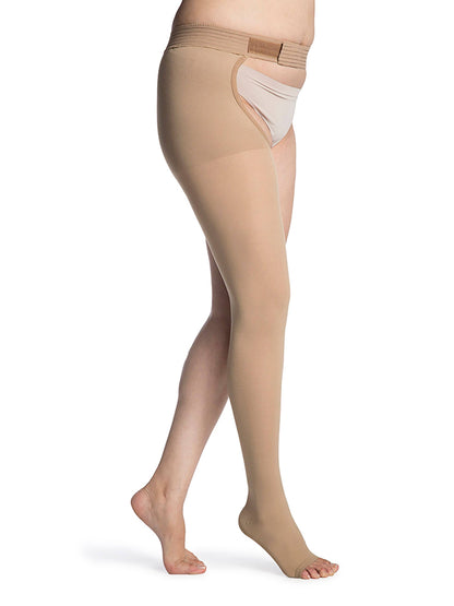 Beige compression stockings being worn on a white background