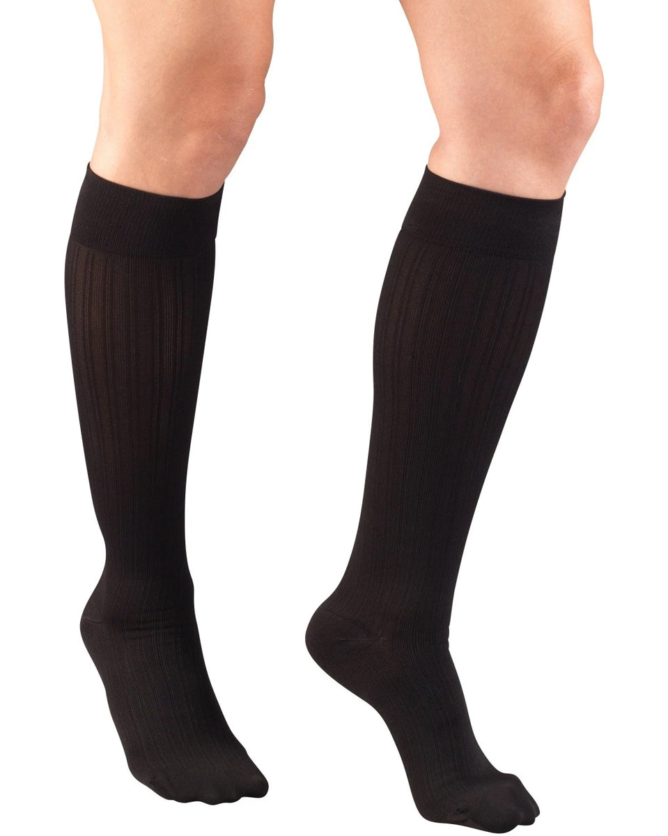 Jobst Relief Black knee-high socks compression socks (30-40 mmHg) worn by a person
