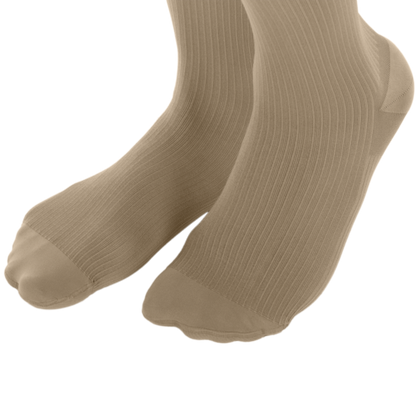Pair of beige socks on a white background
