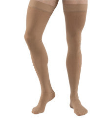 Beige tights worn by a person on a white background