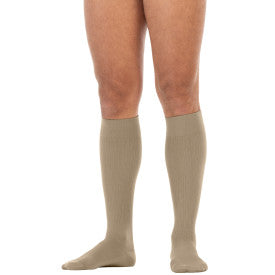 Beige knee-high socks worn by a person on a white background